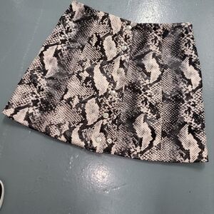 Stylish Snakeskin Mini Skirt with Stud Details